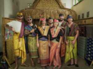 A group of travellers in traditional Indonesian clothing