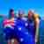 3 girls holding the Australian flag on a cruise ship