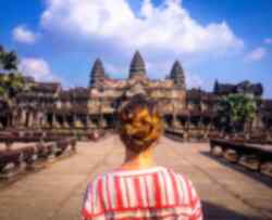Traveller standing in front of Angkor Wat in Cambodia