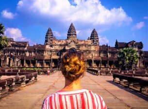 Woman looking over angkor wat in cambodia