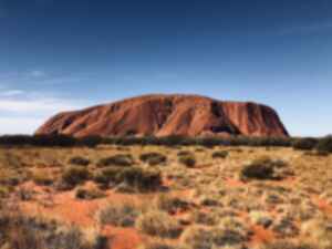 Uluru set against a clear blue sky