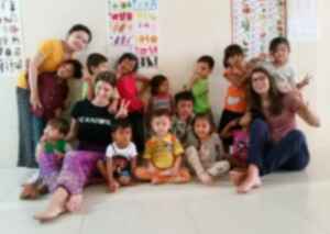 Volunteers with children in a classroom