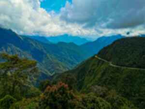 The winding Death Road and surrounding mountains in Bolivia