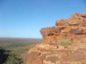A cliff face of red rocks in outback Australia
