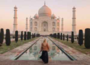 Traveller in front of the Taj Mahal, India 