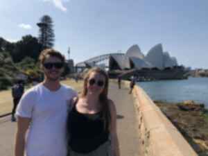 Two travellers in front of the Sydney Opera House, Australia