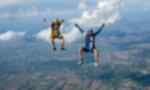 Two travellers skydiving