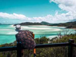 Person looking across Whitsundays from Whitehaven Beach, Australia