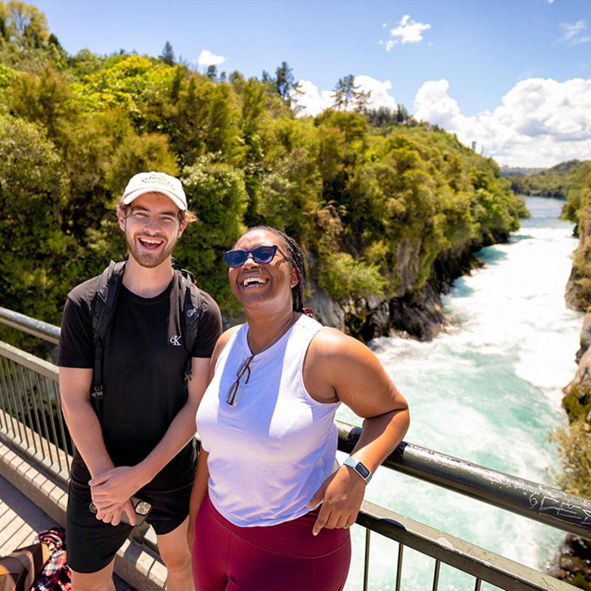 Travellers at taupo huka falls in New Zealand