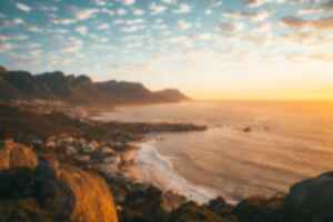 Aerial view of Cape Town, beaches and surrounding mountains at sunset
