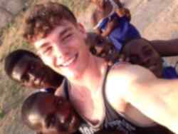 Volunteer with children in Ghana