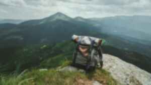 A backpack sitting atop a mountain